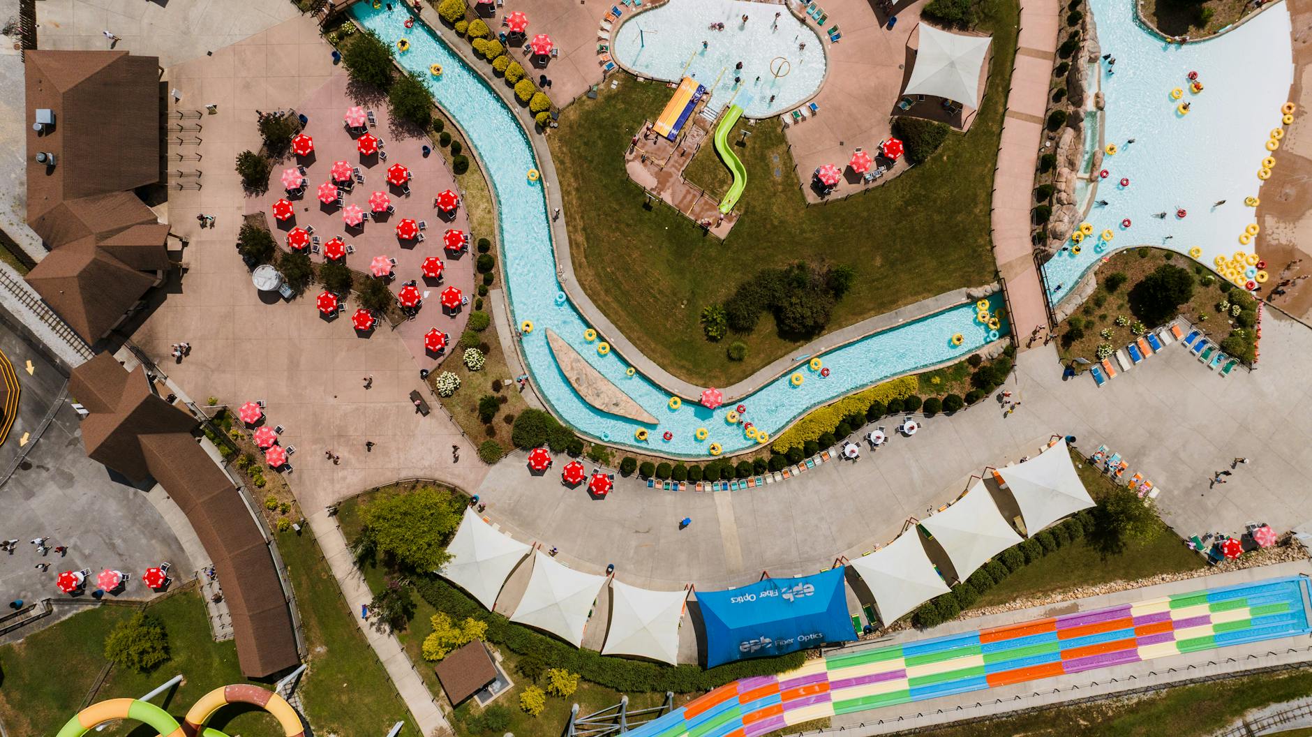 Aerial perspective of a vibrant water park with slides and pools in Rossville, Georgia.