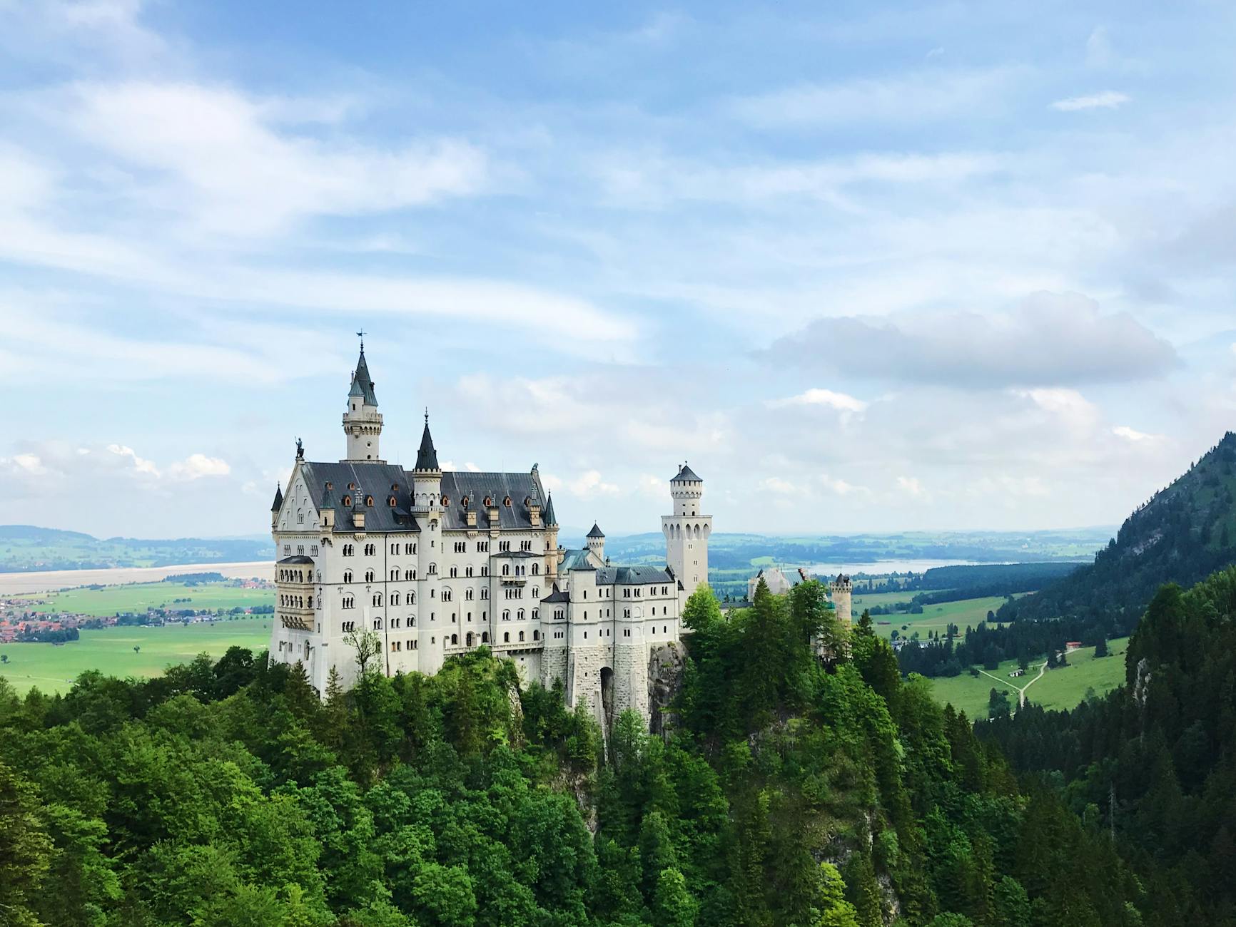 A stunning view of Neuschwanstein Castle in Schwangau, captured under a clear sky.