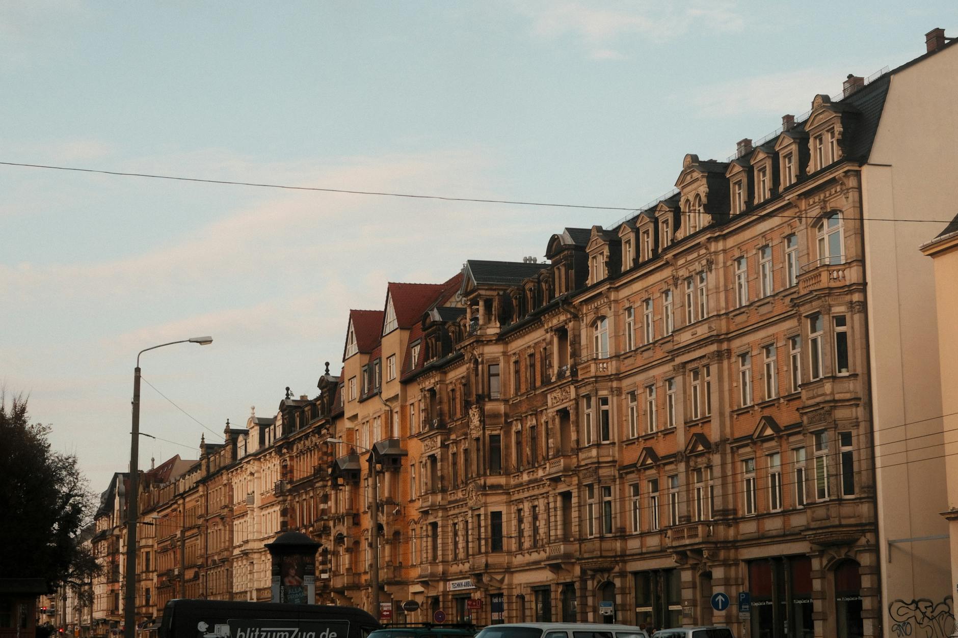 Historic street view of Dresden's charming architecture under a pastel sky.