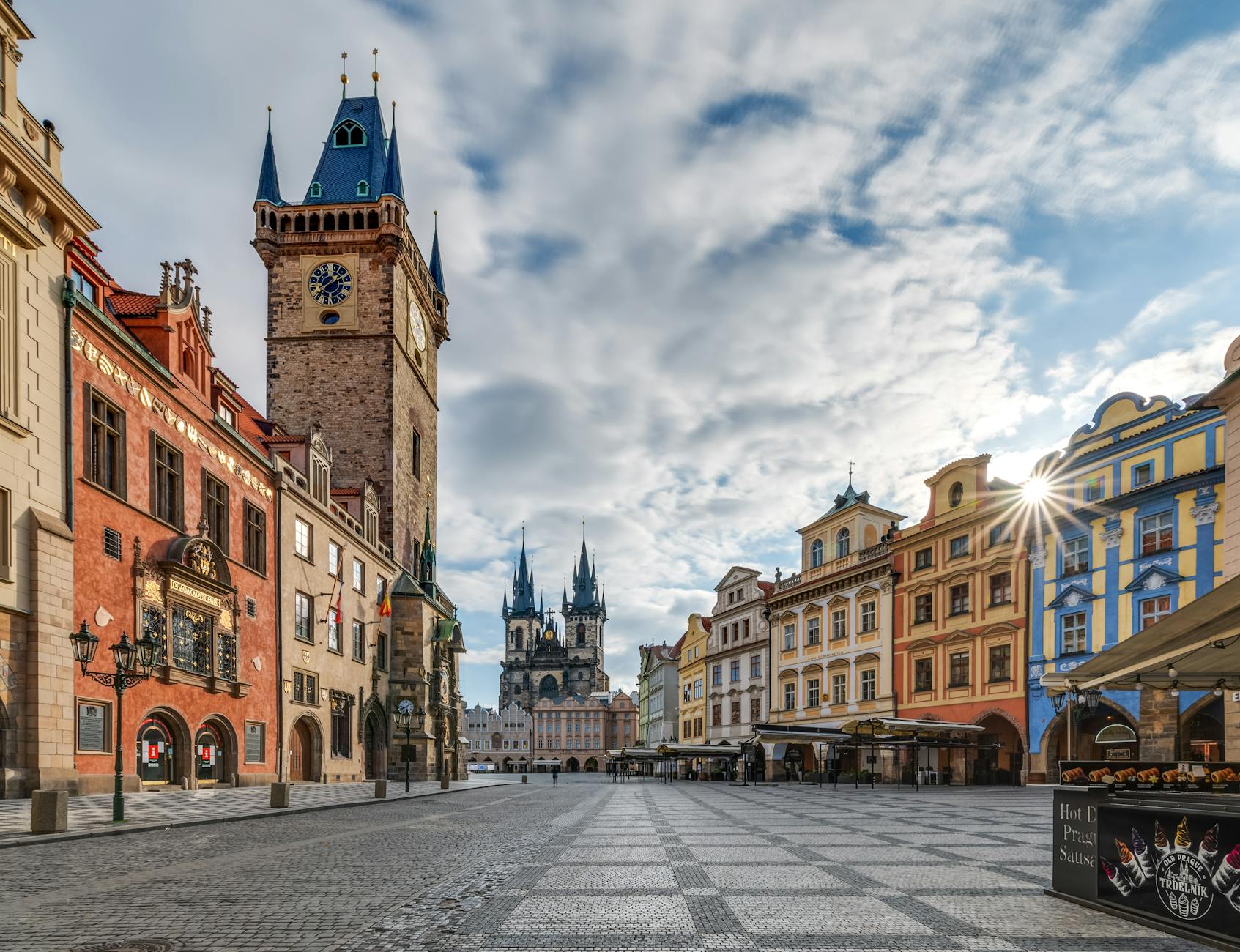 Explore the stunning architecture of Prague's Old Town Square featuring the famous astronomical clock and cityscape.