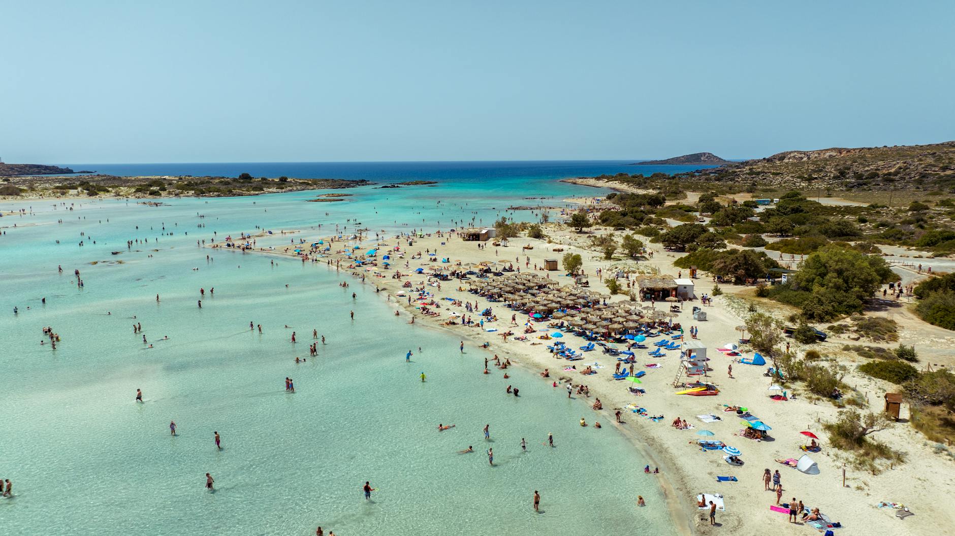 Discover the pristine sands and turquoise waters of Elafonissi Beach, Crete, Greece, from above.