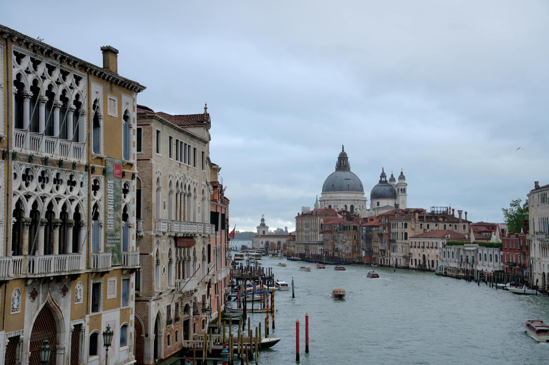 Beautiful view of Venice's Grand Canal with historic architecture on a cloudy day.